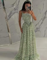 فستان سهرة أخضر فاتح مطرز بالزهور والكريستال