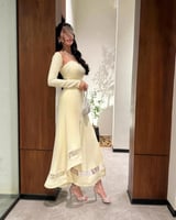 فستان أصفر ميدي بقصة أنثوية فاخرة