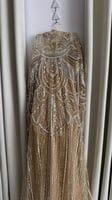 فستان سهرة ذهبي مطرز بالترتر والكريستال
