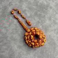 سبحة خشب مضغوط برتقالي