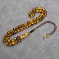 سبحة كهرمان شوائب طبيعي