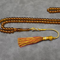 سبحة زعفراني عسلي ٩٩ حبة مع كركوشة تفصال