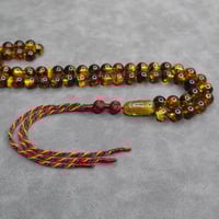 سبحة كهرمان شوائب طبيعي