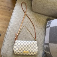 LOUIS VUITTON لويس ڤيتون