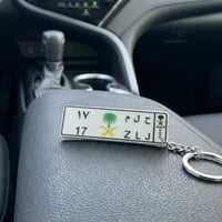 ميدالية مفاتيح بشعار السيفين والنخلة – طباعة UV مل...