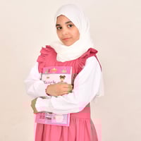 مريول ابتدائي وردي ياقة دائرية وكشكش عريض