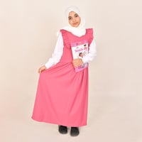 مريول ابتدائي وردي ياقة دائرية وكشكش عريض