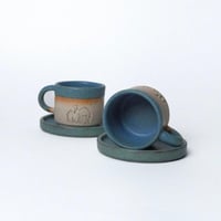 كوب مع صحن عام الابل