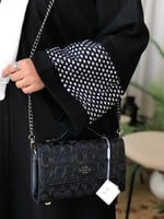 حقيبة كوتش أصلية بتصميم أنيق ومقبض علوي