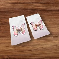 أخراص شكل فراشة بثيم