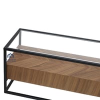 طاولة تلفزيون قاعدة حديد لون اسود سطح زجاج شفاف وق...