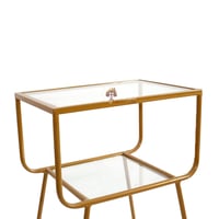 طاولة جانبية دورين قواعد حديد لون ذهبي وسطح زجاج ش...
