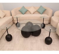 طقم طاولات رخام صناعي شكل كوره لون اسود سطح زجاج