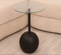 طاولة خدمة رخام صناعي شكل كره لون أسود سطح زجاج شف...