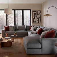 كنب رمادي بتصميم مختلف فريد