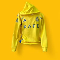 بلوفر بشعار النصرلون الاصفر بلوفر شتوي