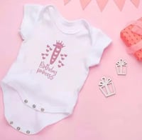 ملابس عيد ميلاد البيبي