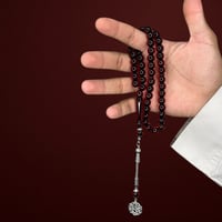 سبحة بكلايت بلون العنابي.