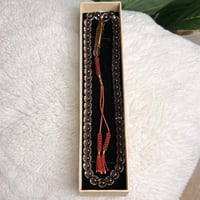 سُبحة بكلايت بُني شفاف كركوشة.