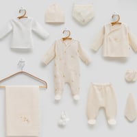 طقم مواليد استقبال 10 قطع بنقشة - و بربتوز سكري لح...