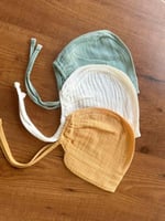 طقم قبعات مواليد موسلين 3 قطع ألوان باستيل بونيه ن...