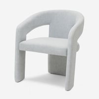 كرسي عصري بتصميم هندسي ناعم يجمع بين الراحة والفخا...