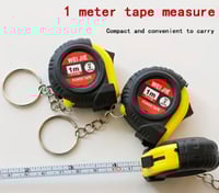 ميدالية مفاتيح على شكل متر قياس