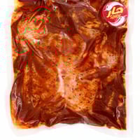 الفروج الذهبي دجاج كامل متبل حار 700 جم