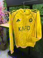 بلوفر شتوي نادي النصر 2026 أصفر دافئ وأنيق