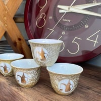 فنجال ياباني اصدار قديم - يحمل شعار الدلة