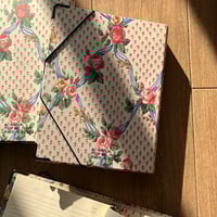 ملف يحتوي على دفاتر مقسّمه