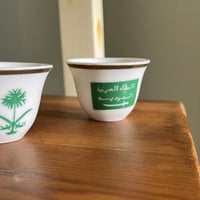 فنجال يحمل شعار ( سيفين ونخلة - المملكة العربية ال...