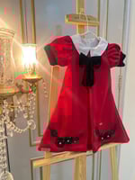 فستان أحمر مزين بالمخمل الاسود