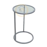 طاولة خدمة سطح زجاج شفاف وقواعد حديد لون فضي