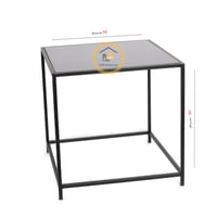 طاولة خدمة فاخرة بقواعد حديدية سوداء وسطح زجاجي أس...