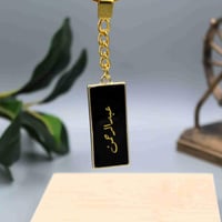 ميدالية مفاتيح بتصميم انيق وخفيف باللون الاسود الم...