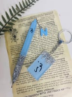 طقم قلم وميدالية انيقة مزخرفه بورق الذهب او الفضة...