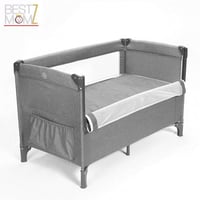 سرير أطفال متنقل بجانب سرير الأم