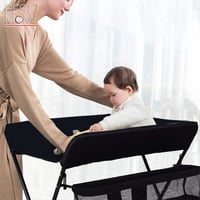 طاولة تغيير حفاضات قابلة للطي مع منظم عصري