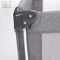 سرير أطفال متنقل بجانب سرير الأم