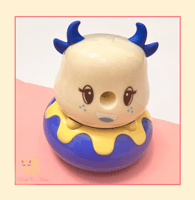 مبراة على شكل دمية