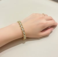 سوار بتصميم مستوحى من رولكس مرصعة بالزركون مطلية ذ...