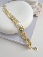 سوار بيسمارك مع حجر لولو في الوسط مطلي ذهب. MB-223