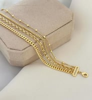 سوار مصمم من عدة سلاسل مطلي ذهب. MB-099