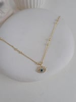 خلخال مع تعليقة بشكل عين زرقاء مطلي ذهب. MA-025