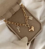 سلسال مطلي دهب مع قلب ومفتاح وقفل MN-044