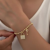 سوار كرات ذهبية مع قفل ومفتاح مطلي ذهب عيار ١٤. MB...