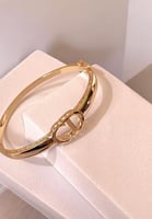 سوار مستوحى من تصميم ديور صلب مرصع بالزركون من الج...