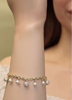 طقم بتصميم مزين بكرات ذهبية مغطاة بالزركون مع حبات...