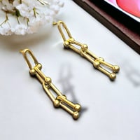 أقراط أذن بثلاث حلقات متداخلة لون ذهبي. ME-016